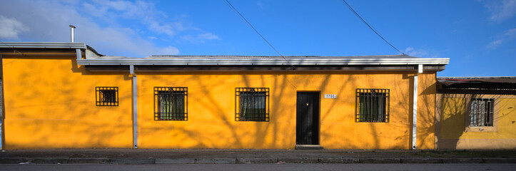 Facade of colorful adobe house in a village in south America, Talca, Chile