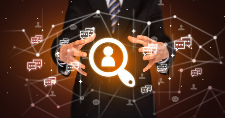 Hand holding social media icons