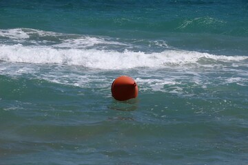 Italy: Red buoy in the sea of ​​Salento.