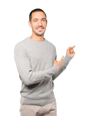 Friendly young man making a gesture of welcome