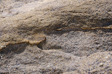 Close-up view of a sandstone cliff at the California pacific ocean coast
