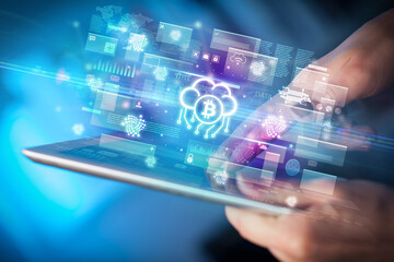 Close-up of a hand using tablet, currency concept