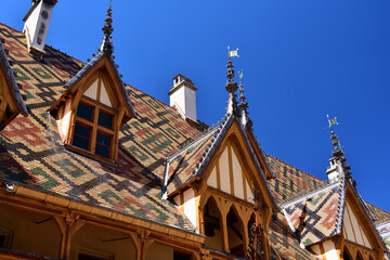 Obraz premium Burgundy, France. A traditional roofed building in Beaune. August 8, 2022.