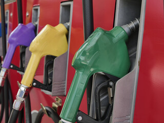 fuel dispenser. The green fuel nozzles are arranged in several colors. Gasoline and diesel service...