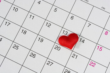 Red heart shape on the date of the 13th day in the calendar.