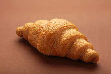 Freshly baked croissant on brown wooden background Warm Fresh Buttery Croissants and Rolls. French and American Croissant and Baked Pastries.