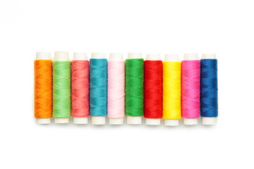 Color sewing threads isolated on white background.