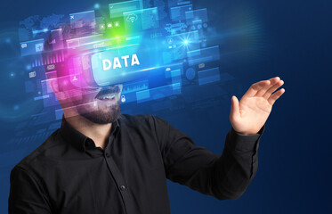 Businessman looking through Virtual Reality glasses