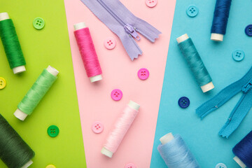Colorful buttons with threads on colorful background