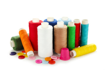 Sewing threads of different colors on reels isolated on a white background.