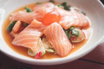 Delicious spicy papaya salad with salmon. Salmon hot and spicy salad