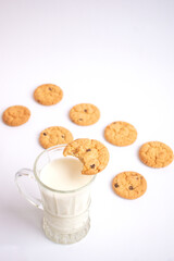 A glass of milk with delicious cookies