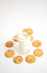 A glass of milk with delicious cookies
