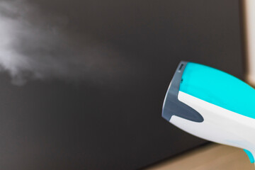 Close up shot of a steam iron. Household