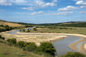 Fototapeta na wymiar View of the Cuckmere river in summer 2022 on a sunny afternoon, South Downs national park, East Sussex, England
