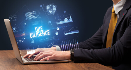 Businessman working on laptop, business concept