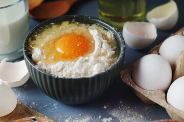 Food ingredients for baking: flour, eggs, milk, sugar	