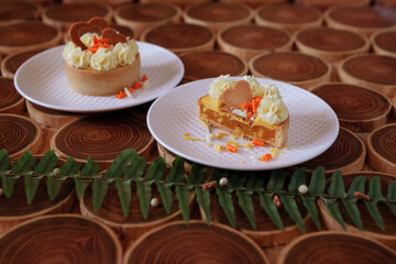 Cake. there are two plates of cake on the table. meal. sweet food