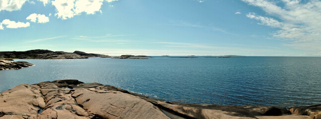 Panoramic view of coastline in nature reserve with sea, rocks and sky