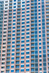 Skyscraper in Austin Texas with glass windows and balconies at the facade
