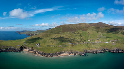 Fototapeta na wymiar landscape view of the turquoise waters and golden sand beach at Slea Head on the Dingle Peninsula of County Kerry