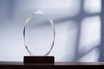 close up of crystal trophy agaist gray background