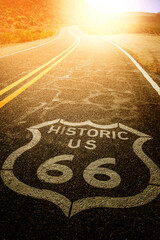 Route 66 sign on asphalt road