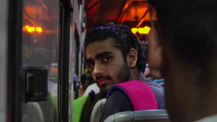 Obraz na płótnie Canvas a boy young passenger sitting in the bus