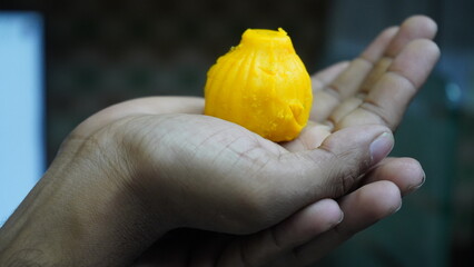 Lord Ganesha's Prasad Modak in hand