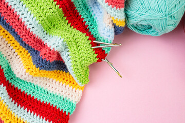 Multicolored crochet lines pattern with hooks and spool