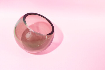 Round bottom spherical vase, isolated on pink background