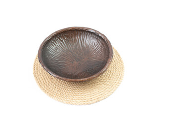 Carved wooden bowl, on a jute rope placemat