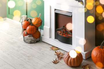 Fototapeta premium Fireplace decorated for Halloween party in room