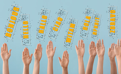 Many raised hands and words HELLO in different languages on blue background