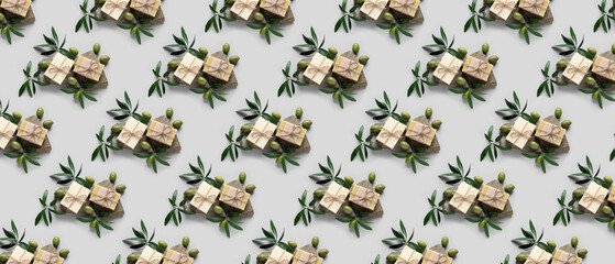 Many soap bars with olive oil extract on grey background. Pattern for design