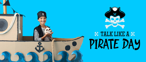 Banner for Talk Like a Pirate Day with little boy and paper ship on blue background