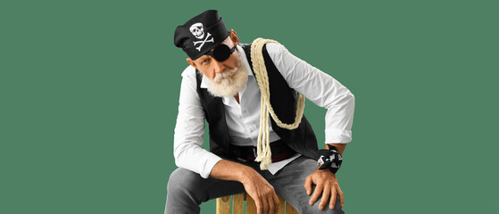 Mature pirate on green background