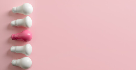 Light bulbs on pink background with space for text. Concept of idea and uniqueness