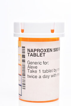 IRVINE, CALIFORNIA - 10 SEPT 2022: A presription bottle of Naproxen pain reliever 500mg capsules.