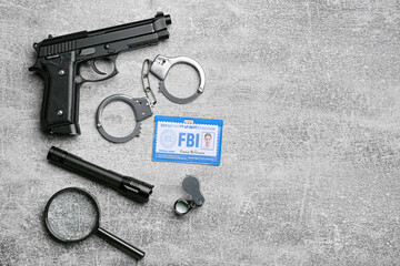 Identification document of FBI agent and accessories on grunge background
