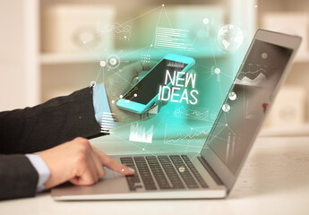 Side view of a business person working on laptop