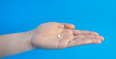 A pill against cardiovascular diseases in the palm of your hand.