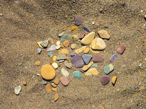 Colorful Rocks On The Shore Of McDonald Lake In Glacier National Park, Montana