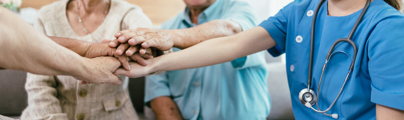 Fototapeta na wymiar Panoramic banner background of elderly human bare hands join together in the middle under with indoors light. Concept Elderly nursing care help and support. Service mind for senior people.