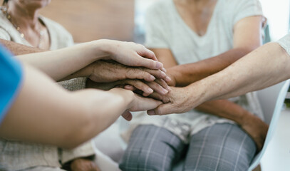 Background of elderly human bare hands join together in the middle under with indoors light. Concept Elderly nursing care help and support. Service mind for senior people.