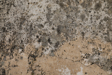 Grey and beige stone wall with cracked and uneven background, space for text, no people and horizontal