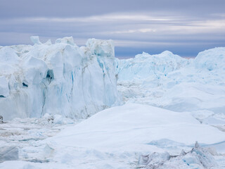 Awe-inspiring icy landscapes at the mouth of the Icefjord glacier (Sermeq Kujalleq), one of the fastest and most active glaciers in the world. A UNESCO world heritage site, Ilulissat, Greenland