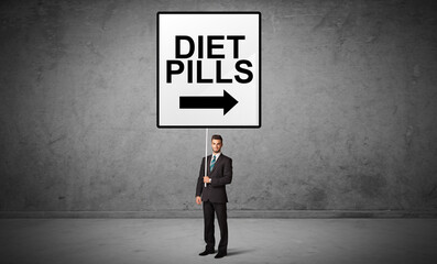 Obraz premium business person holding a traffic sign