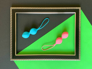 Sex toys. Geisha balls on green background. Useful for sex shop, adult