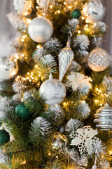 Obraz na płótnie Canvas Beautiful Christmas tree with silver decorations